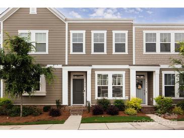 Charming townhome with neutral siding, well-maintained landscaping, and inviting entryway at 512 Morrows Turnout Way, Pineville, NC 28134