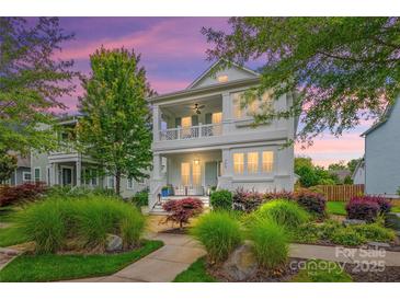 Beautiful two-story home boasts a charming front porch and meticulously landscaped yard at 790 Herrons Ferry Rd, Rock Hill, SC 29730