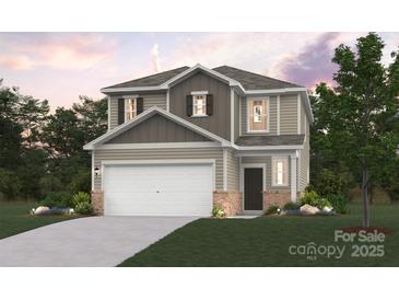 Inviting two-story home with a two-car garage, neutral siding, and a covered front entry for convenient access at 274 Bezelle Ave, York, SC 29745