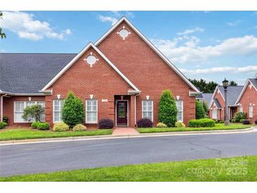 Charming brick home with manicured landscaping, offering curb appeal at 1302 Warrington Pl, Rock Hill, SC 29732