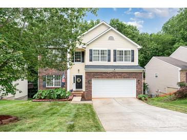 Charming two-story home with a well-manicured lawn and a two-car garage at 3236 Wicklow Ln, Clover, SC 29710