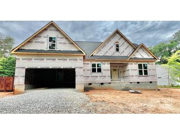 New construction home with a two-car garage and covered entryway, awaiting its finishing touches at 1143 Journey Ln, Salisbury, NC 28146