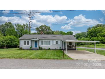 Charming single-story home with a well-manicured lawn and inviting carport at 1266 18Th Ne St, Hickory, NC 28601
