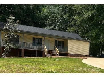 Charming single-story home featuring a welcoming front porch and well-maintained yard at 103 Sycamore Rd, Salisbury, NC 28147