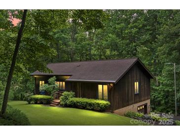 Charming single-story home with a wood exterior and lush green lawn at 460 27Th Avenue Nw Cir, Hickory, NC 28601