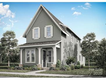 Charming two-story home featuring a welcoming front porch and traditional architectural details at 9113 Maybry Park St # Lot 116, Charlotte, NC 28212