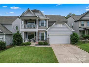 Charming two-story home with a welcoming front porch and attached two-car garage at 1306 San Gabriel Ave, Charlotte, NC 28214