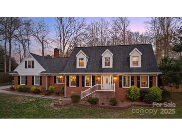 Charming brick home with black shutters, dormer windows, and landscaped front yard at 3500 Sunningdale Ln # 221, Statesville, NC 28625