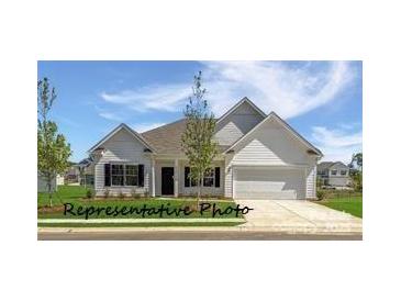 Charming single-story home with white siding, black shutters, and a well-manicured lawn under a bright blue sky at 12184 Muscadine Ct, Midland, NC 28107