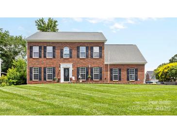 Beautiful brick home with meticulously maintained lawn and classic black shutters at 126 Rocky Trail Ct, Fort Mill, SC 29715