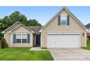 Charming single-Gathering home featuring a two-car garage and a well-manicured lawn at 4714 Adamshire Ave, Concord, NC 28025