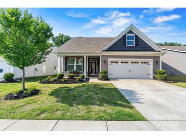 Charming single-Gathering home with well-manicured lawn, landscaping, and a two-car garage at 7809 Creek Park Dr, Denver, NC 28037