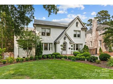 Charming two-story home with manicured landscaping and a well-maintained lawn at 206 Hillside Ave, Charlotte, NC 28209