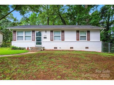 Charming single-story home featuring a brick foundation and well-maintained landscaping at 2328 Danforth Ln, Charlotte, NC 28208