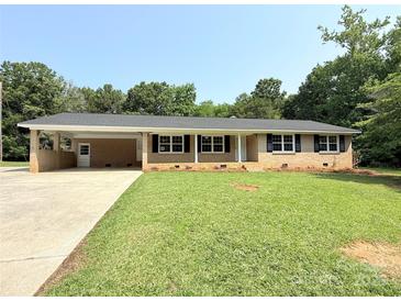 Charming ranch-style home with a covered carport and well-maintained lawn at 279 Bailey Rd, Lancaster, SC 29720