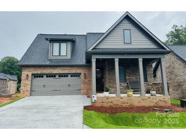 Charming single-Gathering home featuring a covered front porch and two car garage at 29 Shanklin Ln, Denver, NC 28037