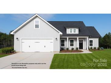 Charming one-story home featuring a two-car garage, covered front porch, and well-manicured lawn at 4018 Deerstone Ln # 24, Clover, SC 29710
