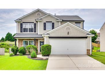 Charming two-story home with a well-manicured lawn, two car garage, and classic curb appeal at 1583 Cold Creek Pl, Huntersville, NC 28078