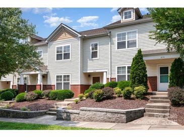 Charming townhouse featuring a well-manicured lawn and inviting front entrance at 18137 Amberwood Glen Dr, Cornelius, NC 28031