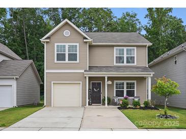 Charming two-story home with a well-maintained lawn and inviting front porch at 3951 Tersk Dr, Midland, NC 28107