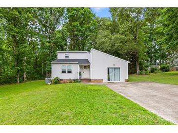 Charming home showcasing a modern design with a well-maintained lawn and a long driveway at 221 Reliance Rd, Kings Mountain, NC 28086