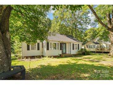 Charming single-story home with mature trees and a well-maintained lawn in a quiet neighborhood at 1072 5Th Ne St, Hickory, NC 28601