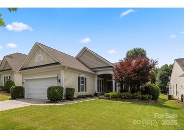 Charming single-story home featuring a two-car garage and a well-manicured lawn and garden at 56119 Finches Ct, Indian Land, SC 29707