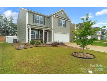 Two-story home with gray siding, stone accents, and a well-manicured lawn showcasing its curb appeal at 1323 Mifflin Ln, Dallas, NC 28034