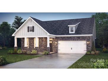 Charming single-Gathering home with stone accents, white trim, a two-car garage, and manicured landscaping at 2070 Skyhawk Dr, York, SC 29745