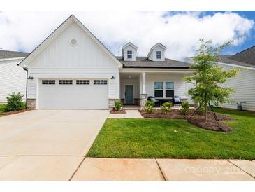 Charming single-story home featuring a well-manicured lawn and attached two-car garage at 25952 Appleyard Ct, Lancaster, SC 29720