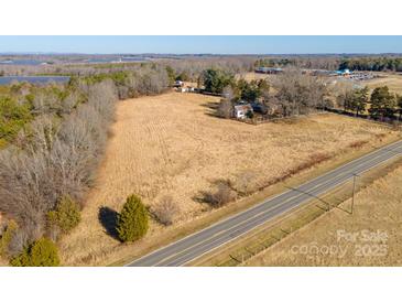 Panoramic aerial view of the property showcasing land, trees, a solar array and the surrounding area at 2808 Water Plant Rd, Maiden, NC 28650