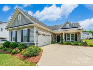 Charming single Gathering home with a manicured lawn and two car garage at 174 Pine Eagle Dr, Rock Hill, SC 29732