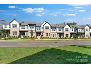 Charming townhome exterior with brick and siding accents, manicured lawn, and inviting curb appeal at 3124 Beacon Heights Rd, Indian Land, SC 29707