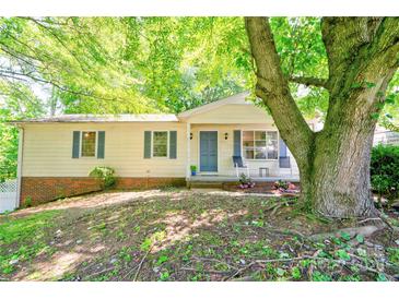 Charming single-story home with a covered front porch and well-maintained landscaping beneath the shade of mature trees at 3043 Charles Rd, Shelby, NC 28152