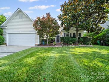 Charming home with well-manicured lawn and beautiful landscaping at 11909 Creek Turn Dr, Charlotte, NC 28278