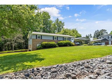 Charming two-story home with a well-manicured lawn and inviting front entrance at 3269 Tolley St, Claremont, NC 28610