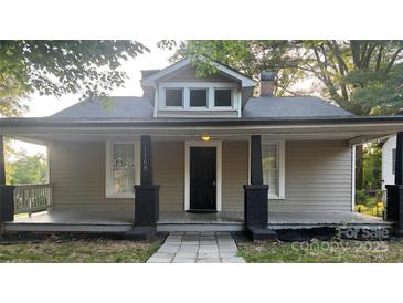 Charming craftsman style home with a welcoming front porch and classic architectural details at 1108 S Meeting St, Statesville, NC 28677