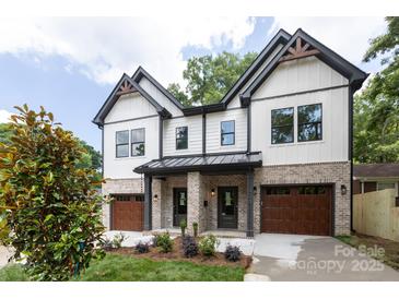 Beautiful two-story townhouse with a modern design, landscaped front yard, and stylish architectural details at 1724 Dallas Ave, Charlotte, NC 28205
