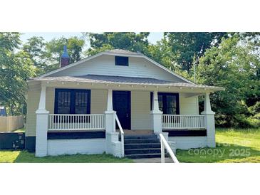 Charming single-story home with inviting front porch and freshly painted exterior at 1012 4Th St, Statesville, NC 28677