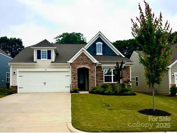 Charming home with stone accents, manicured lawn, and a two-car garage at 110 White Apple Way, Statesville, NC 28625
