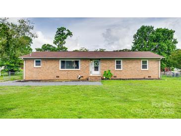 Charming one-story brick home with a well-manicured lawn at 739 Springdale Rd, Rock Hill, SC 29730