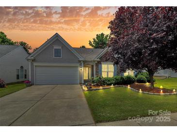 Charming single-Gathering home with a well-manicured lawn, beautiful landscaping, and inviting curb appeal at 8722 Heron Glen Dr, Charlotte, NC 28269