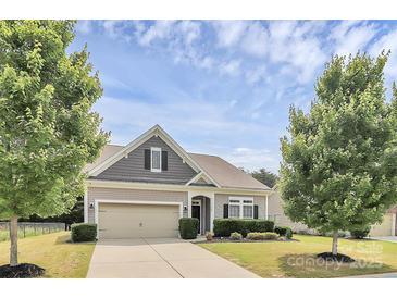 Charming single Gathering home featuring manicured lawn, two-car garage, and craftsman style architecture at 1397 Tupelo Rd, Clover, SC 29710