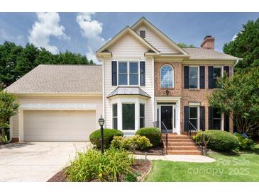 Two-story home with manicured lawn, brick and siding exterior, attached garage, and mature landscaping at 2019 Steeplechase Dr, Rock Hill, SC 29732