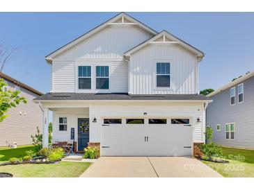 Charming two-story home with a well-manicured lawn and a welcoming front porch at 322 Olympia Way, York, SC 29745
