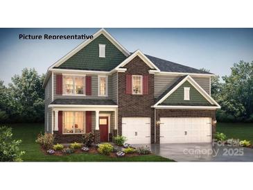 Charming two-story home with gray siding, brick accents, and a well-manicured lawn creating great curb appeal at 2876 Atwater Pond Cir, Denver, NC 28037