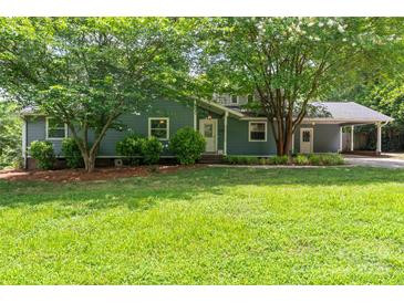 Charming single-Gathering home with well-maintained lawn and mature trees at 6313 Weddington Rd, Concord, NC 28027