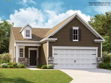 Charming one-story home with a two-car garage and well-manicured lawn at 8426 Norman Forest Rd, Lancaster, SC 29720