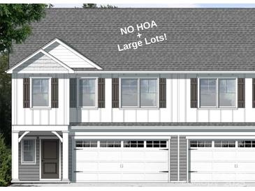 A two-story townhome with white siding, dark shutters, and two-car garage, offering curb appeal at 12526 Susanna Dr, Charlotte, NC 28214
