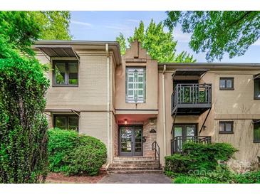 Charming condo with a private balcony and well-maintained landscaping at 201 N Dotger Ave # C8, Charlotte, NC 28207